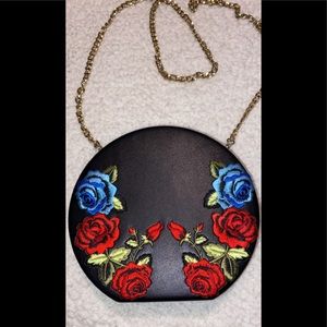 A cross body bag with flower print